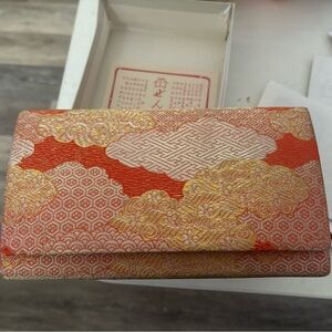 Gold and Orange Clutch with Intricate Patterns